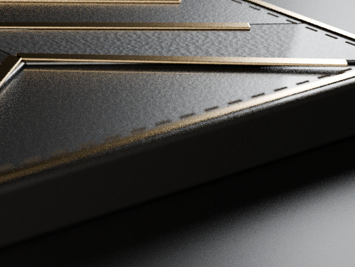 Close view: pebbled obsidian leather and smooth calf divided by a champagne channel with contrast stitching